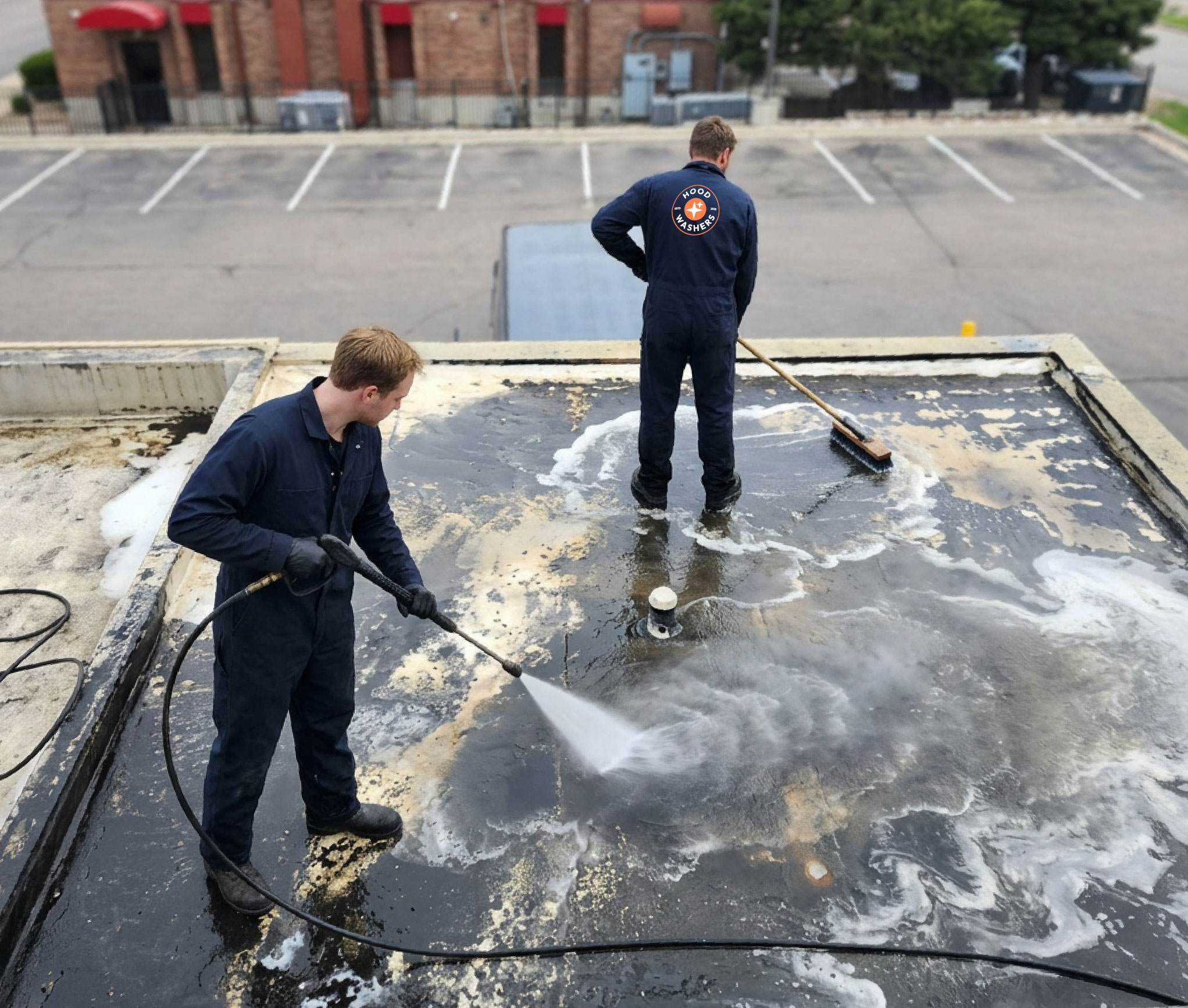 HoodWashers technicians performing rooftop grease removal
